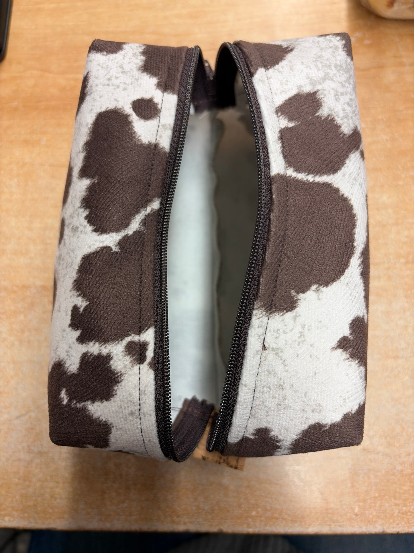 Cowhide look zippered pouch bag