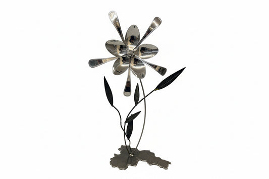 Silver spoon and petals flower