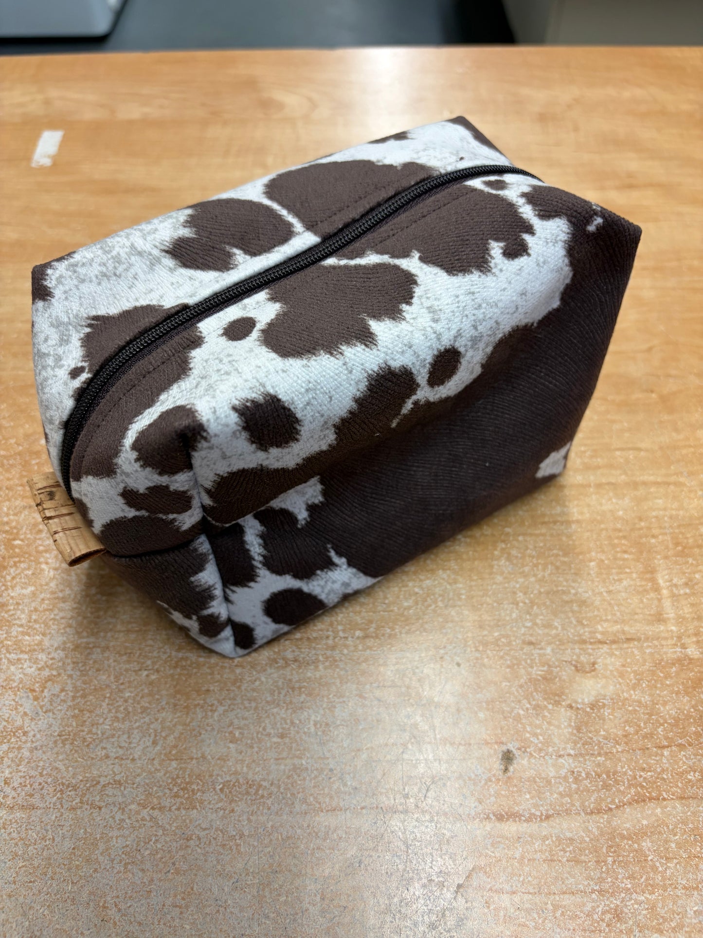 Cowhide look zippered pouch bag